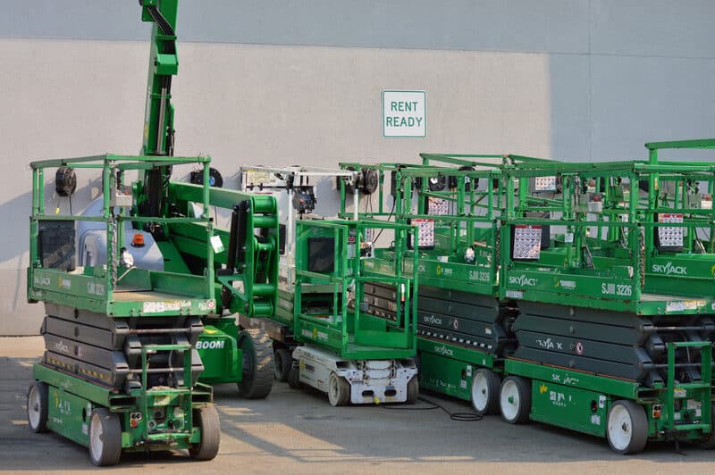 Scissor-lift rental fleet parked together